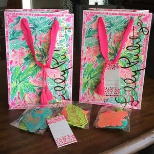 2 Lilly Pulitzer gift bags with decorative tags
